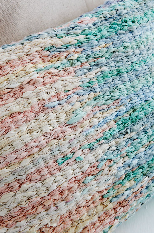 Sari silk peg loom woven rag rug cushion in blue and pink with paint drip pattern and dovetail joins