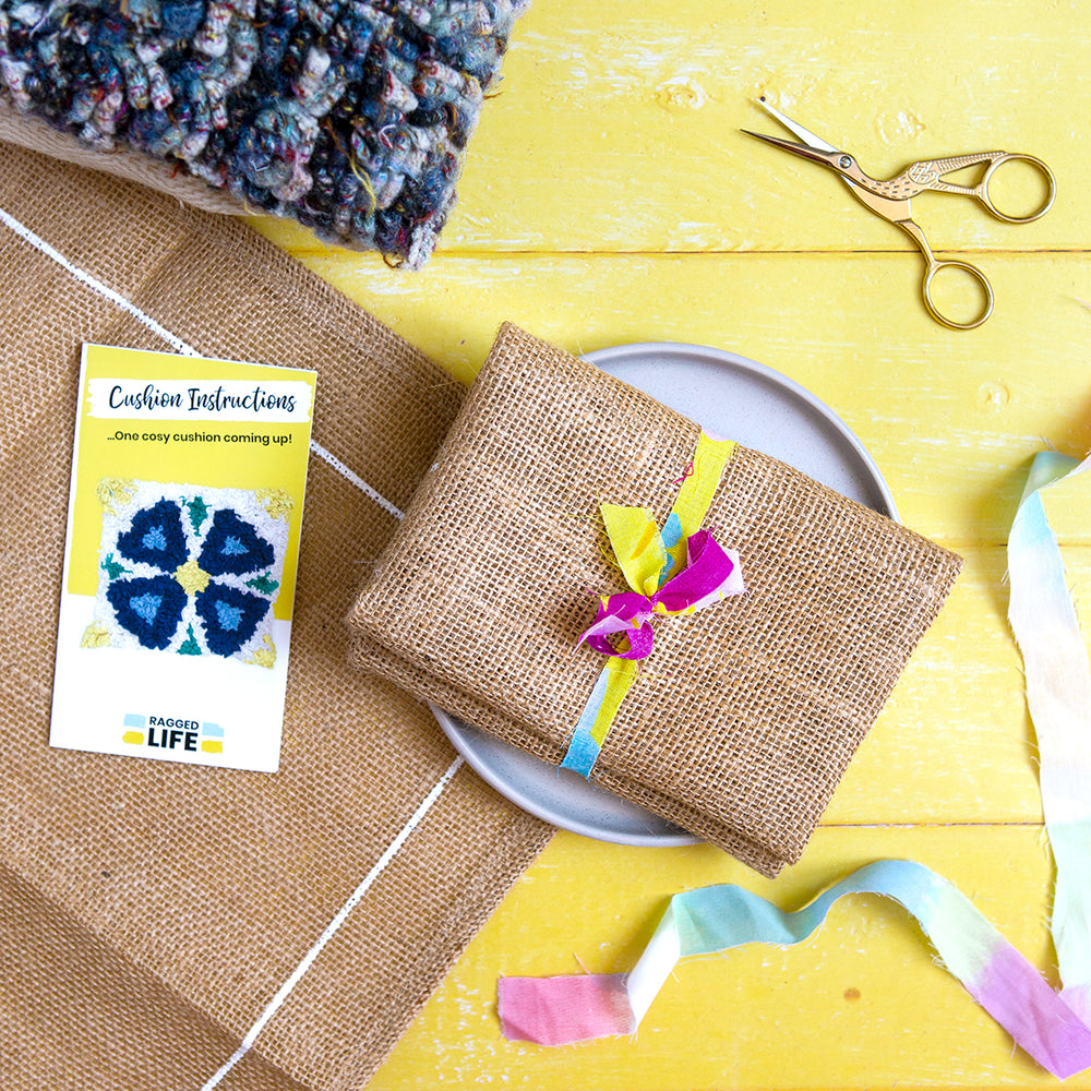Ragged Life hemmed hessian / burlap to make a handmade rag rug cushion tied with a fabric strip