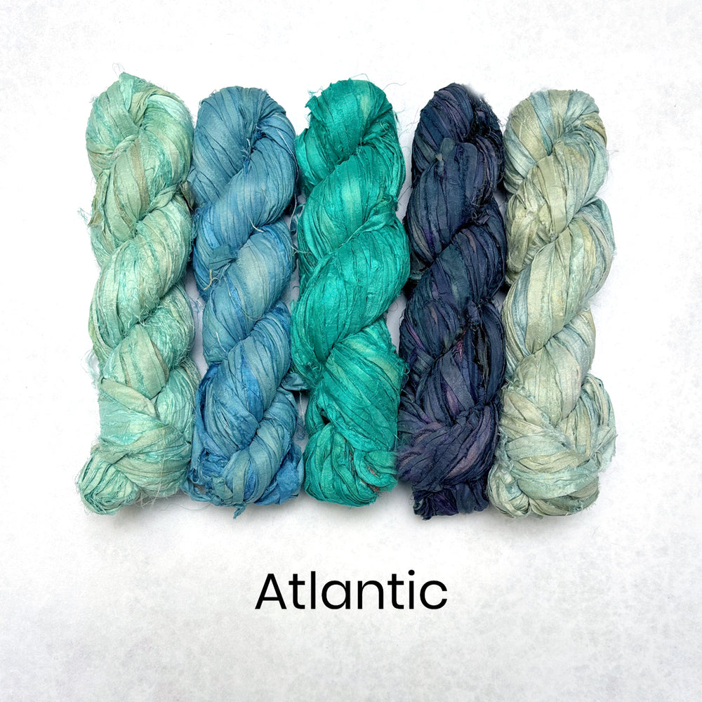 Blue colour scheme of recycled sari silk ribbons in light and dark shades with turquoise. 
