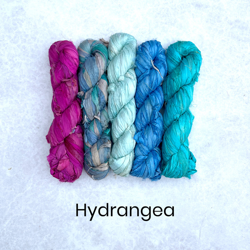 Ragged Life recycled sustainable sari silk strips in five skeins of pink and blue