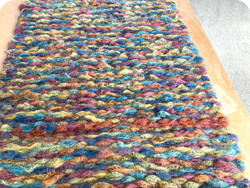 Mandy's peg loom woven rug made using woollen blanket selvedge strips