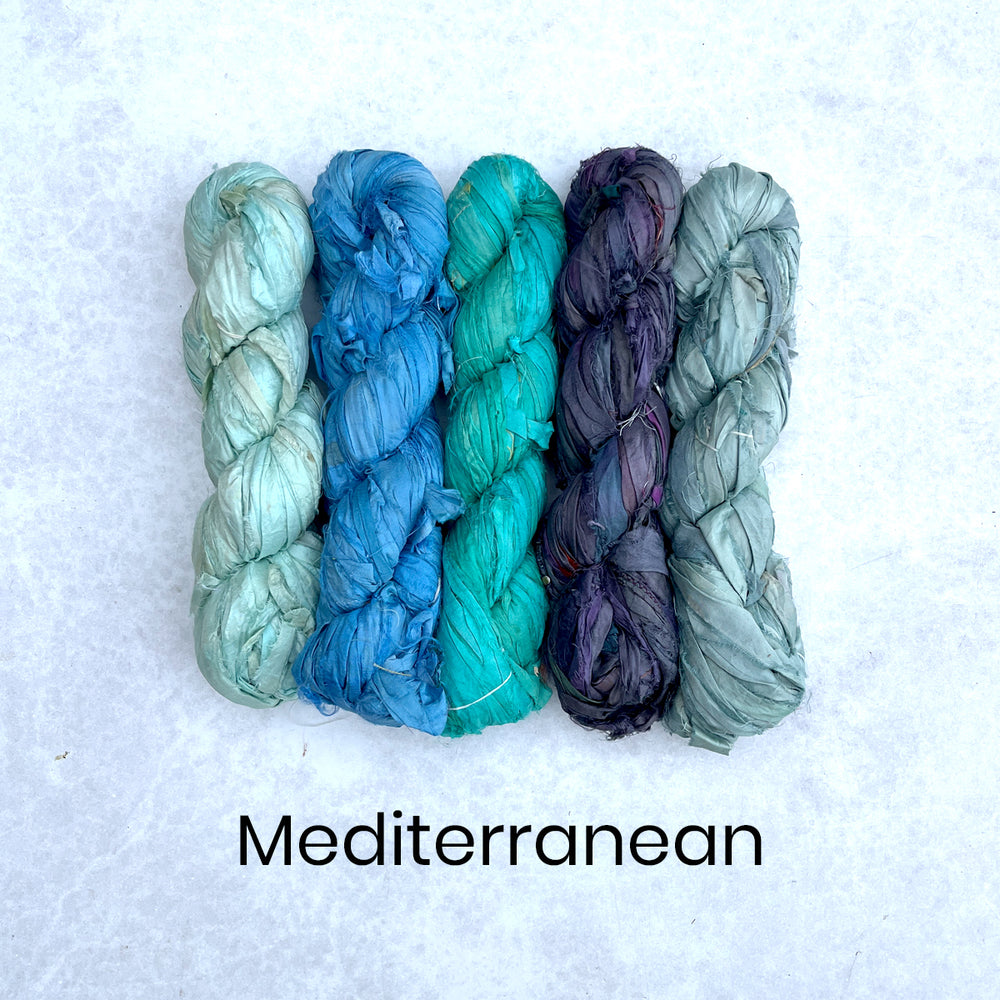 Range of blue sari silk skeins for seascape textile arts