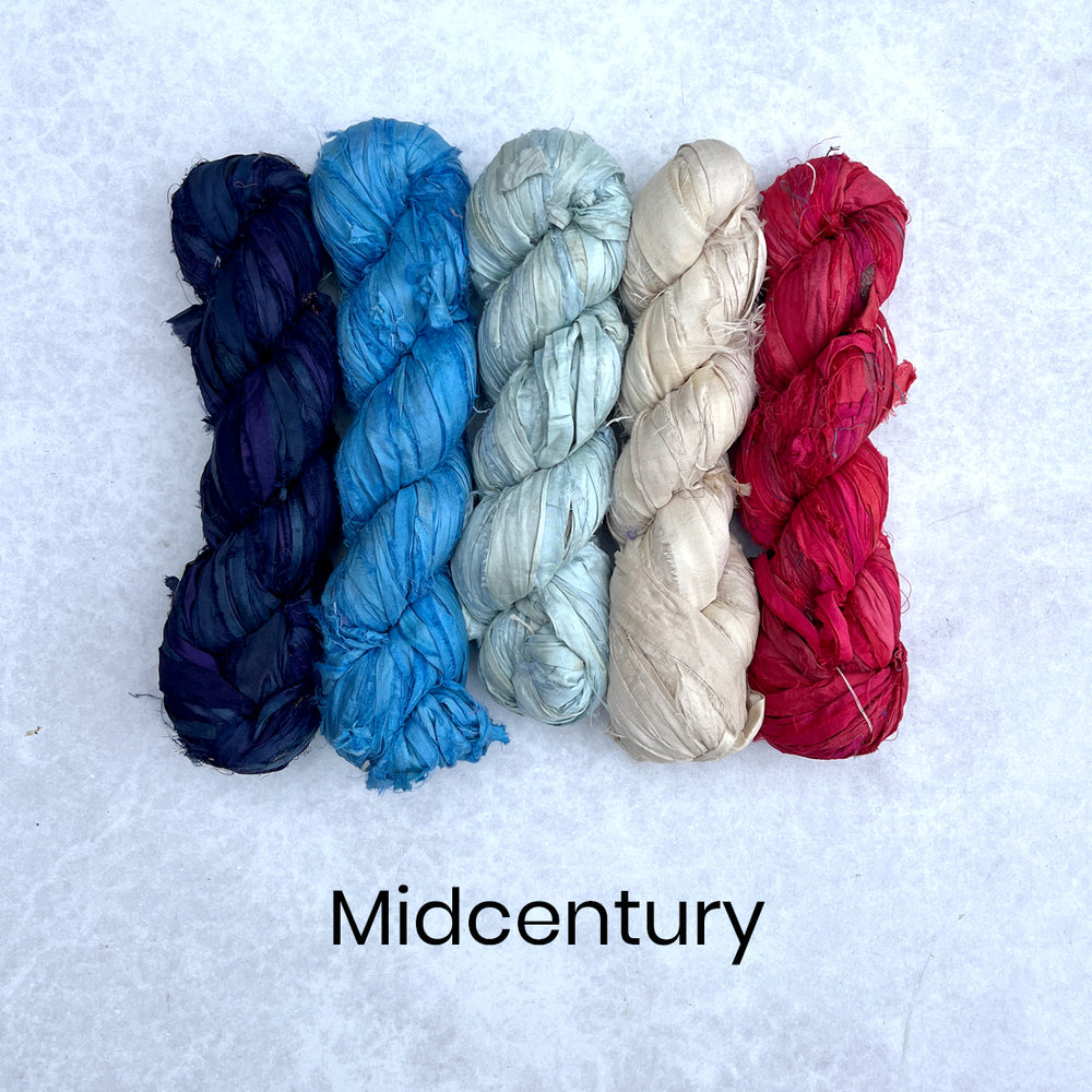 Pretty selection of blue, cream and red sari silk ribbons for fibre crafts and peg loom weaving