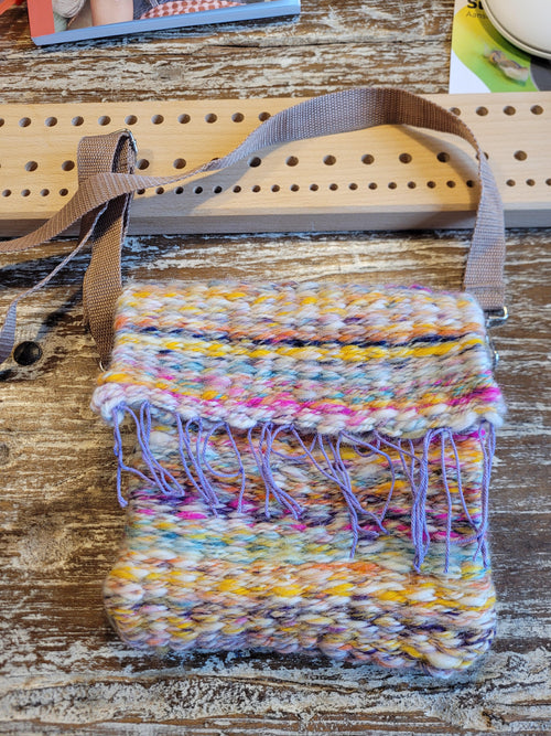 Bag made using peg loom woven knitting yarn and wool in pastel colours