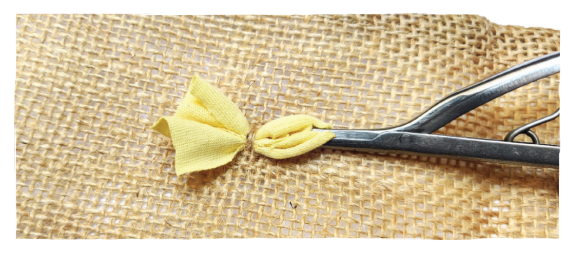 Short shaggy rag rugging with a spring tool and yellow fabric