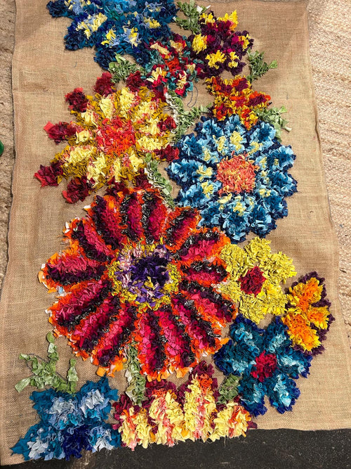 Floral design short shaggy traditional British rag rug made on old potato sack