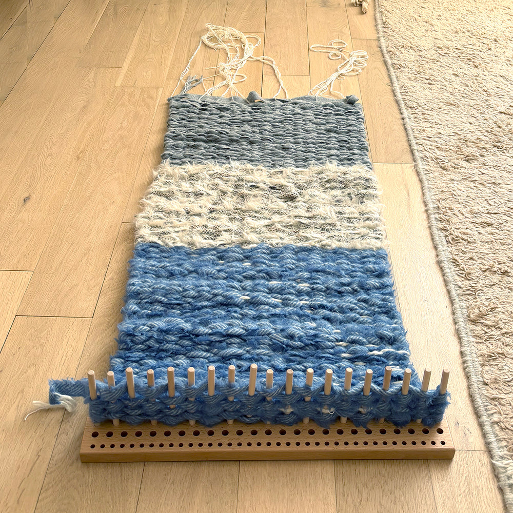 Demonstration of how a peg loom works showing striped pattern and weaving building up down the warp strings. 50cm wooden peg loom from Ragged Life