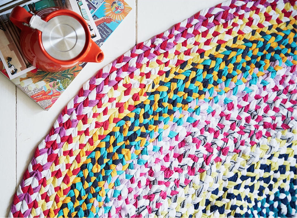 Handmade braided rag rug in rainbow colours