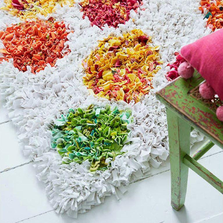 White spotty shaggy rag rug in children's bedroom