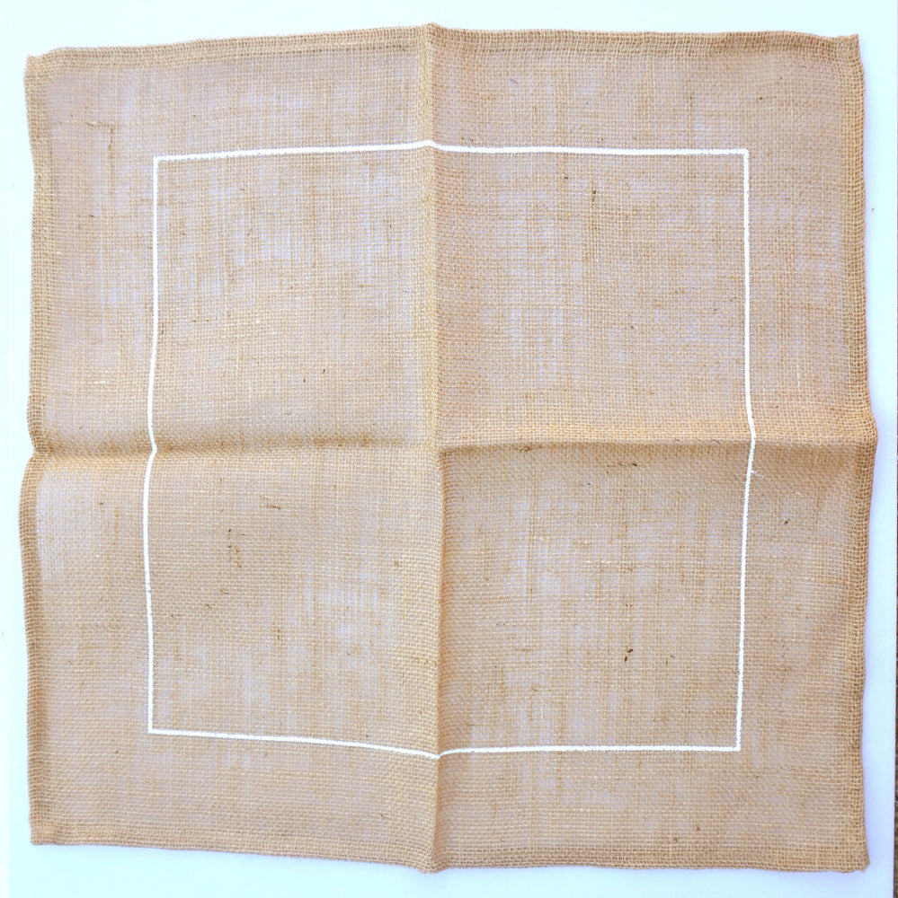 hessian / burlap hemmed to make a handmade rag rug cushion