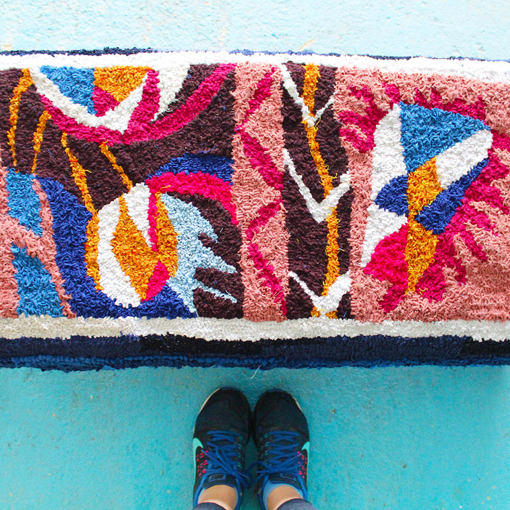 Hooked rag rug upholstered ottoman