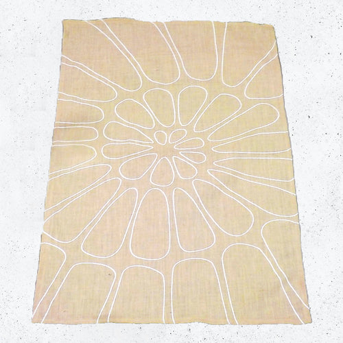 A large piece of beige hessian with a pre-printed spiral design.